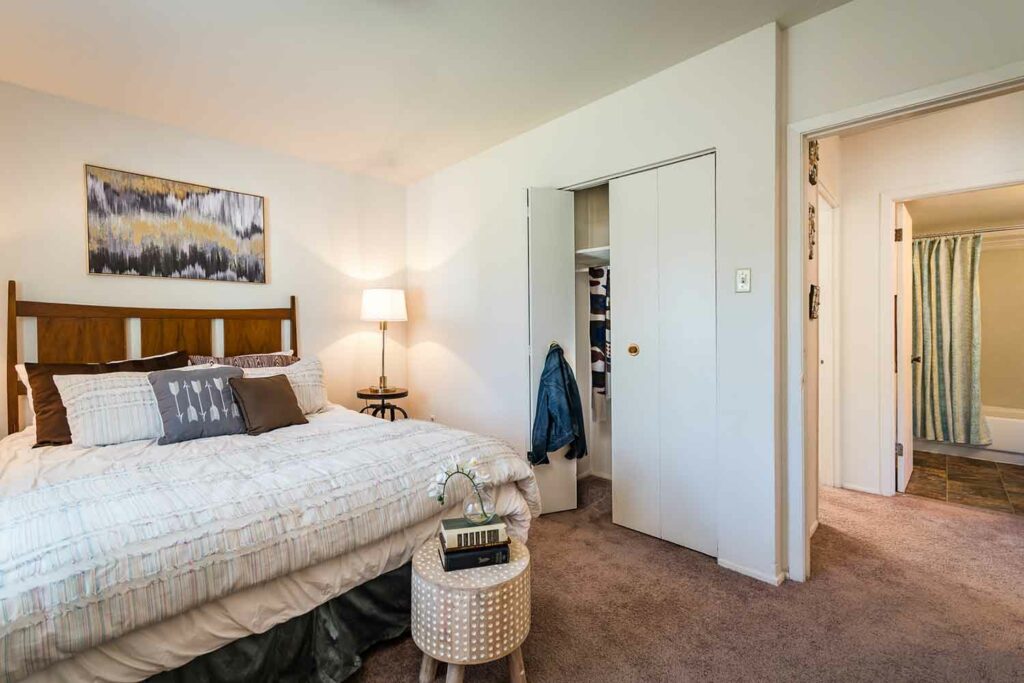 Spacious bedroom with plush carpeting and a spacious closet in our two bedroom floor plan
